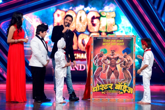Starting from Left- Boogie Woogie host Sargun Mehta and Sunny looks on the poster while Shreyas unveils the poster